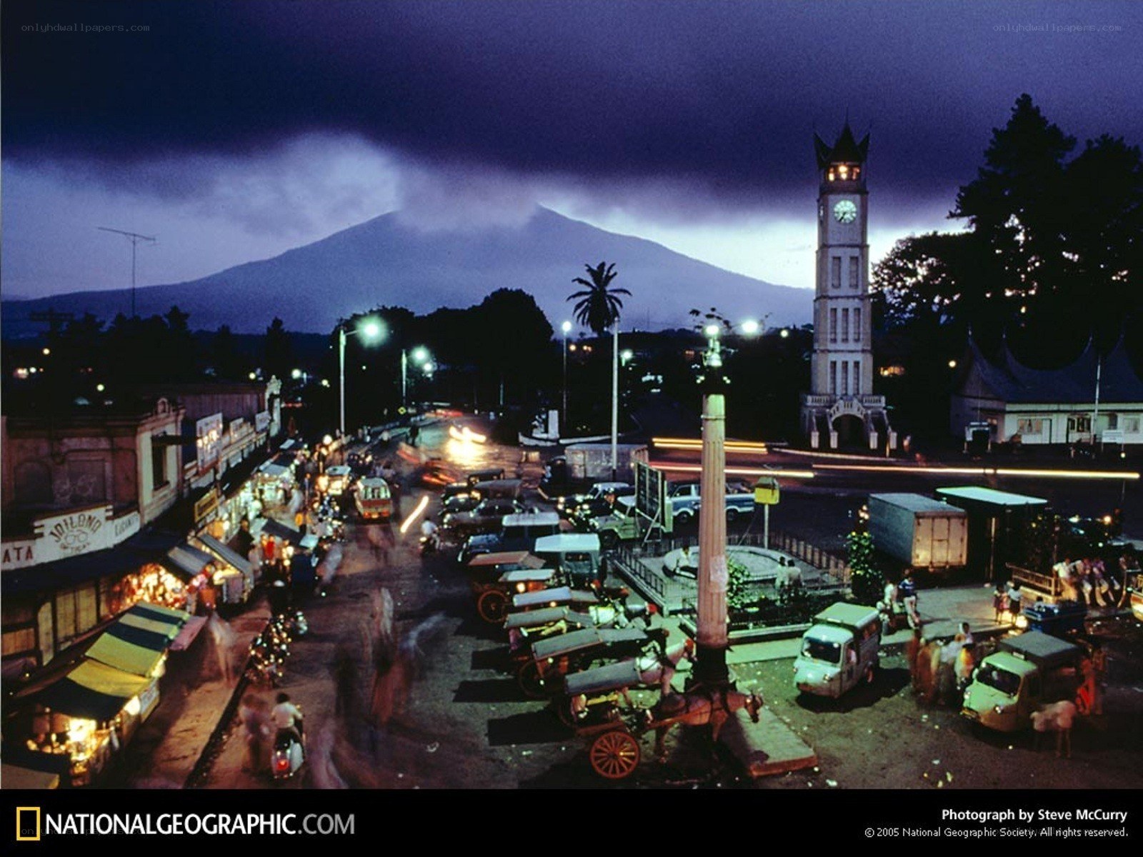 Nighttime city scene with volcano