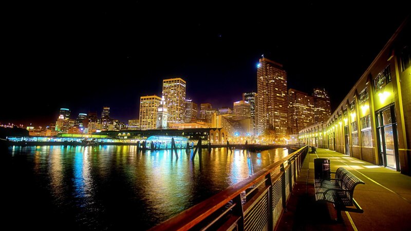 nighttime city skyline by the water