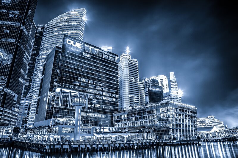 Nighttime city skyline by the water
