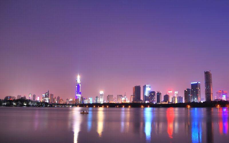 nighttime city skyline by the water