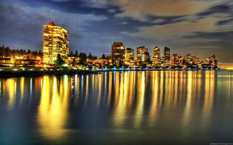 nighttime city skyline by the water