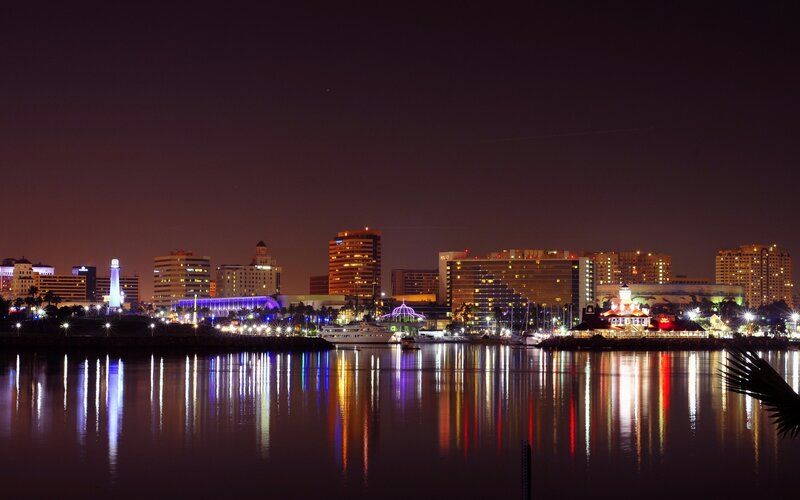 Nighttime city skyline by the water