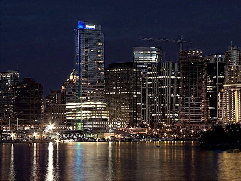 nighttime city skyline by water