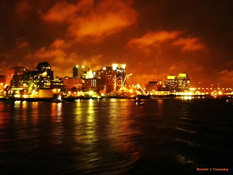 nighttime city skyline by water