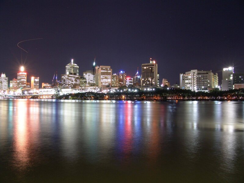 nighttime city skyline by water