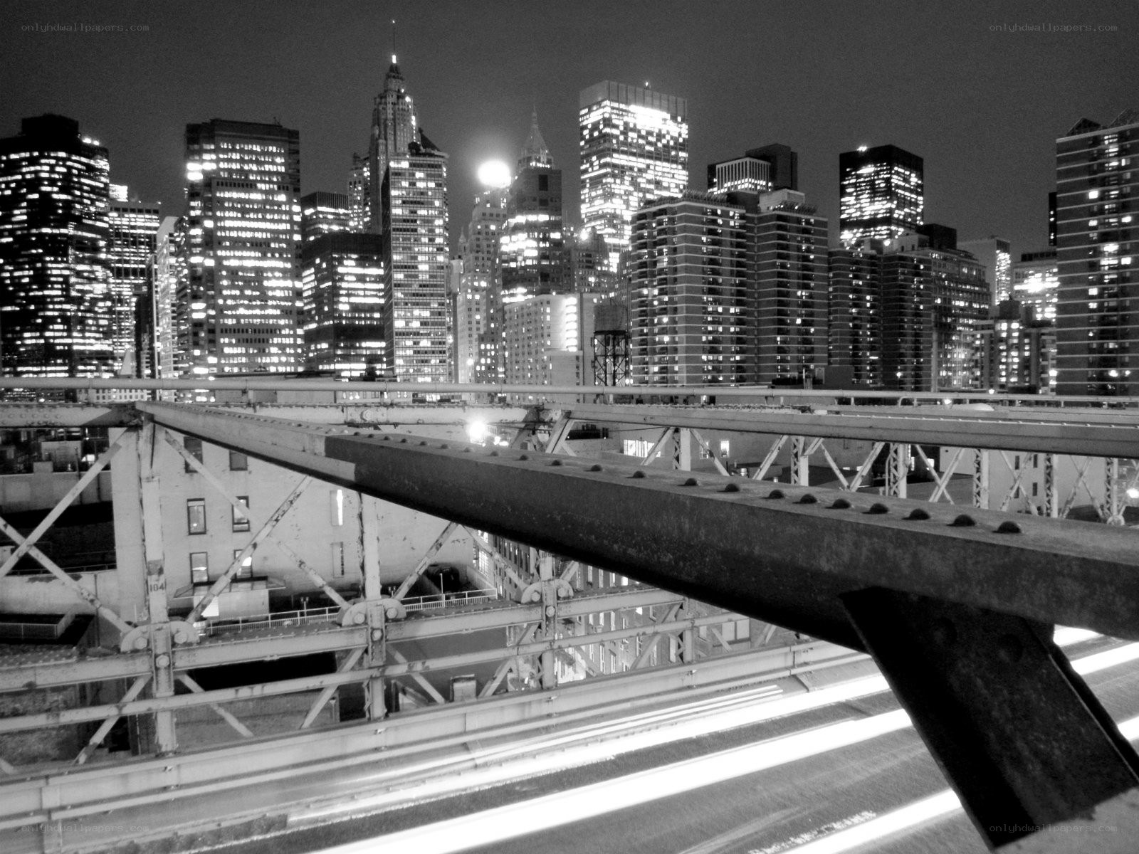nighttime city skyline from bridge
