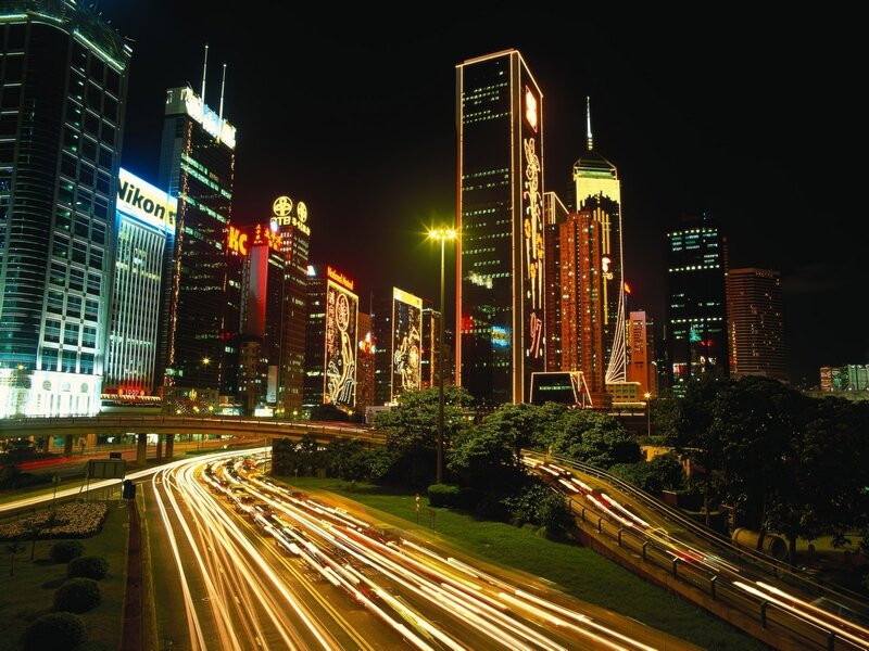 Nighttime City Skyline — Highway