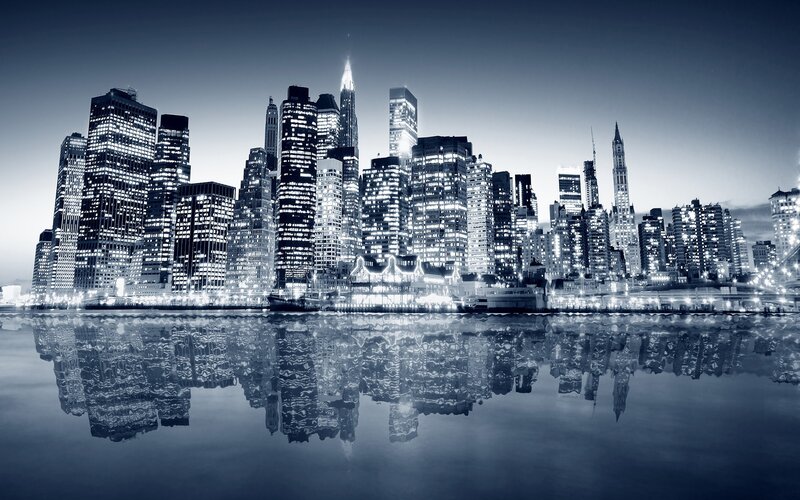 nighttime city skyline reflection