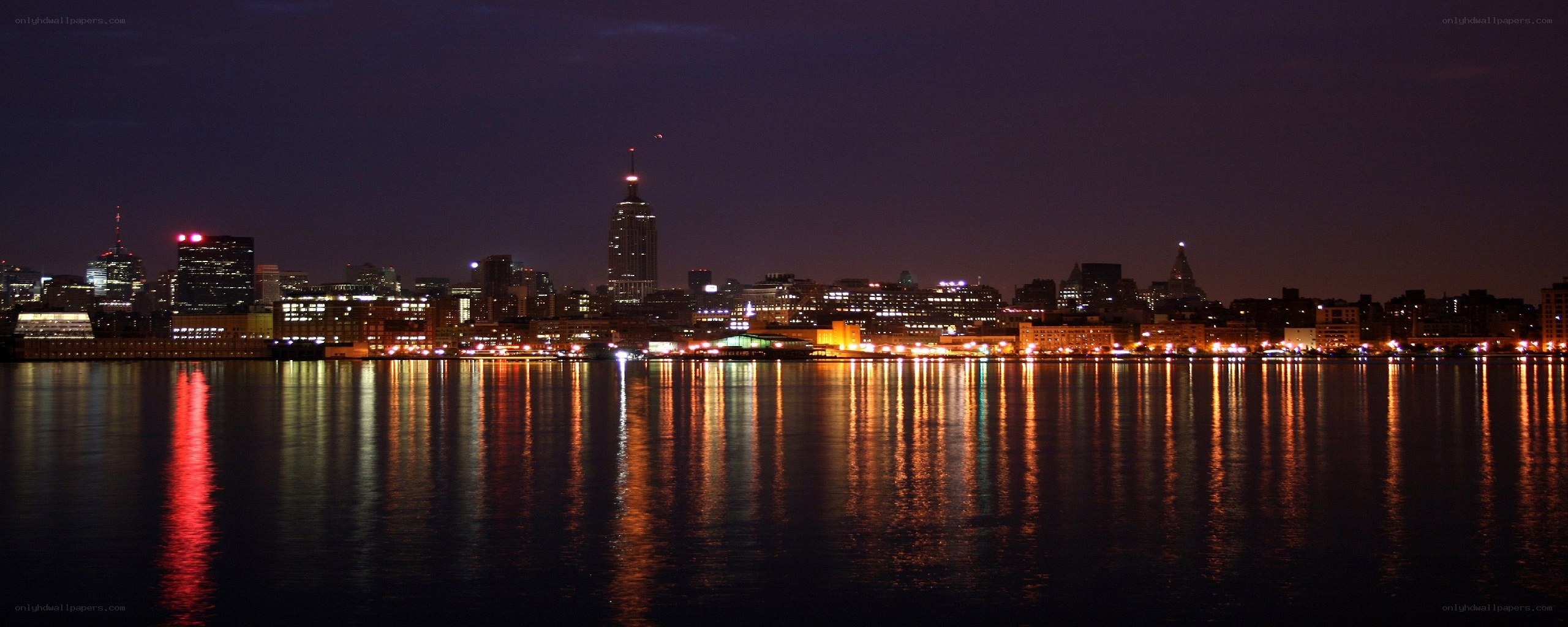 nighttime city skyline reflection