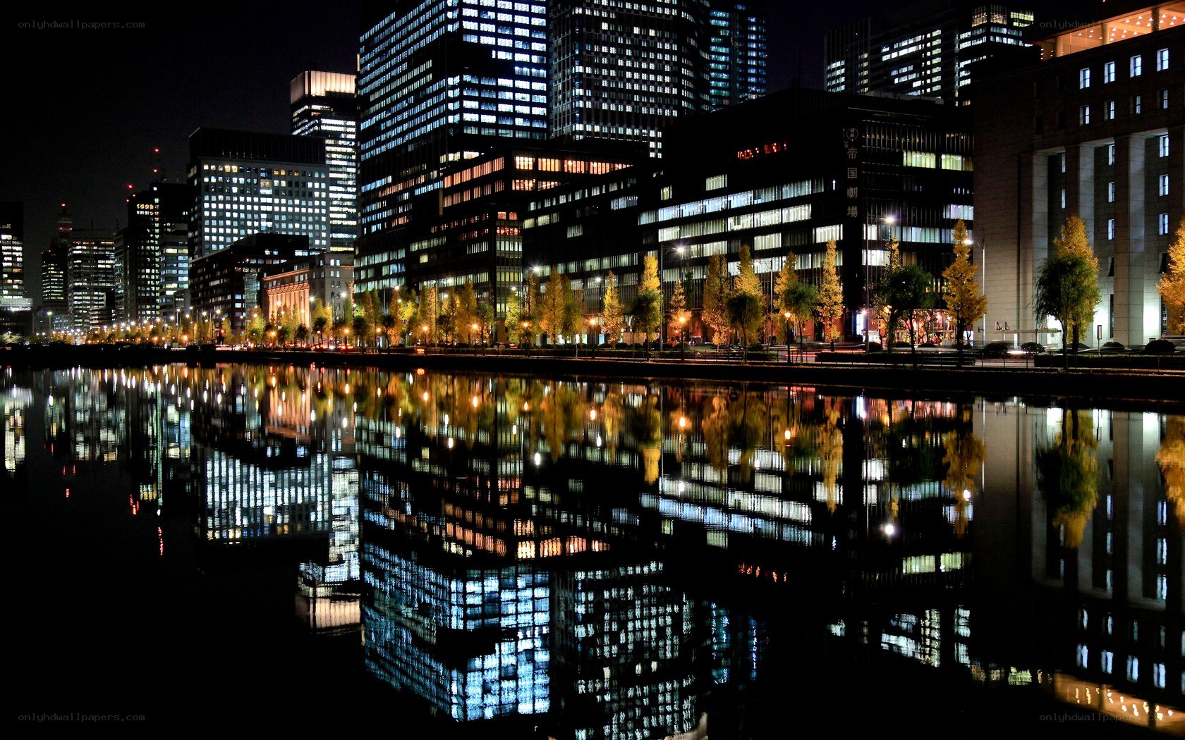 nighttime city skyline reflection