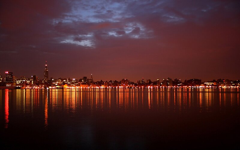 nighttime city skyline reflection