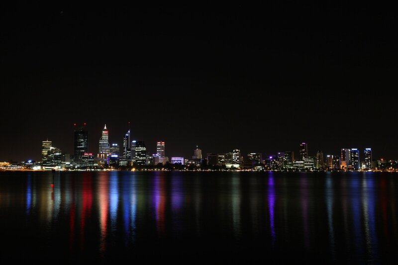 nighttime city skyline reflection