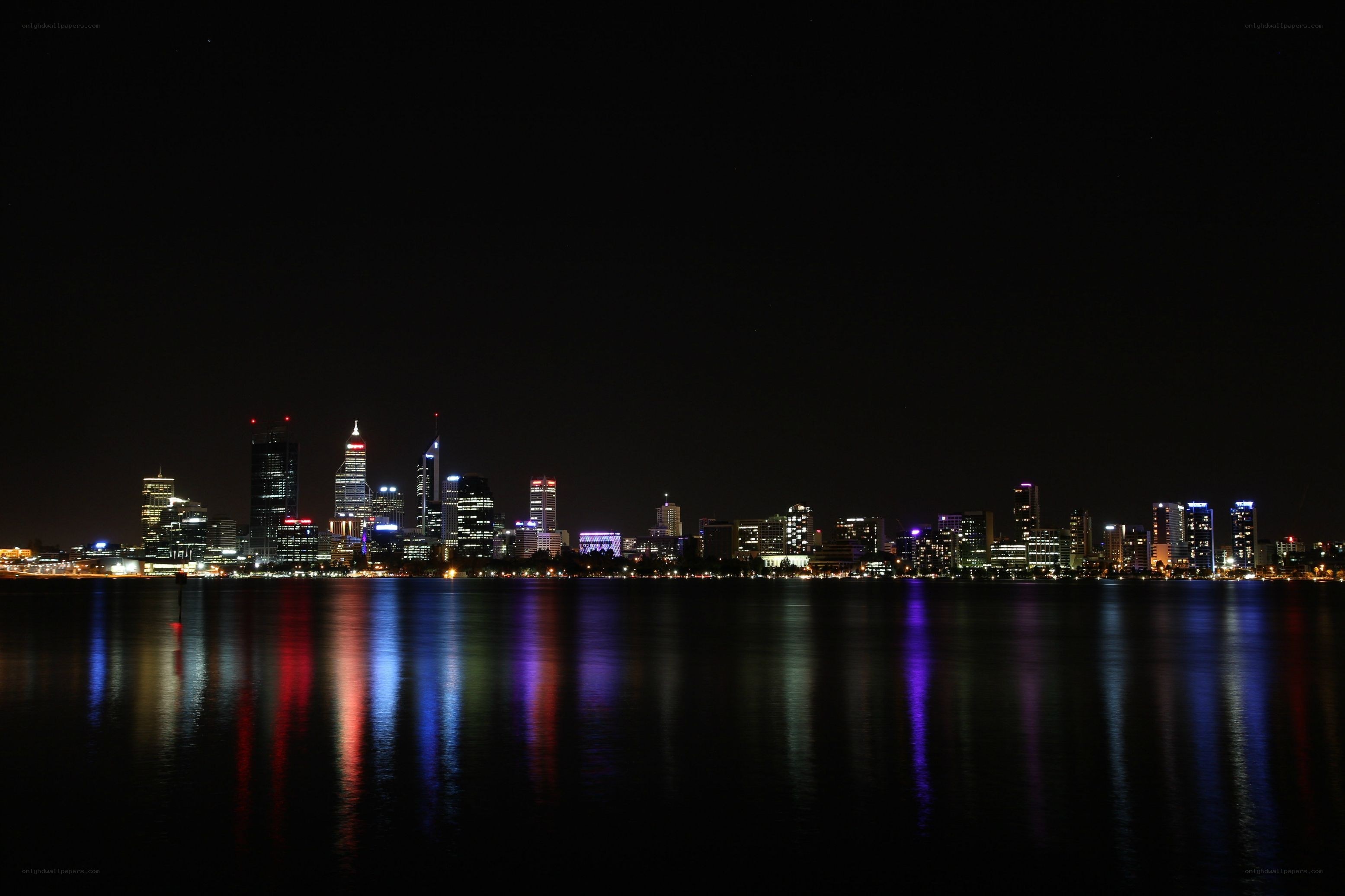 nighttime city skyline reflection