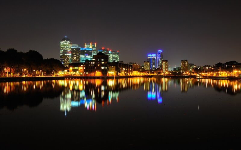 nighttime city skyline reflection