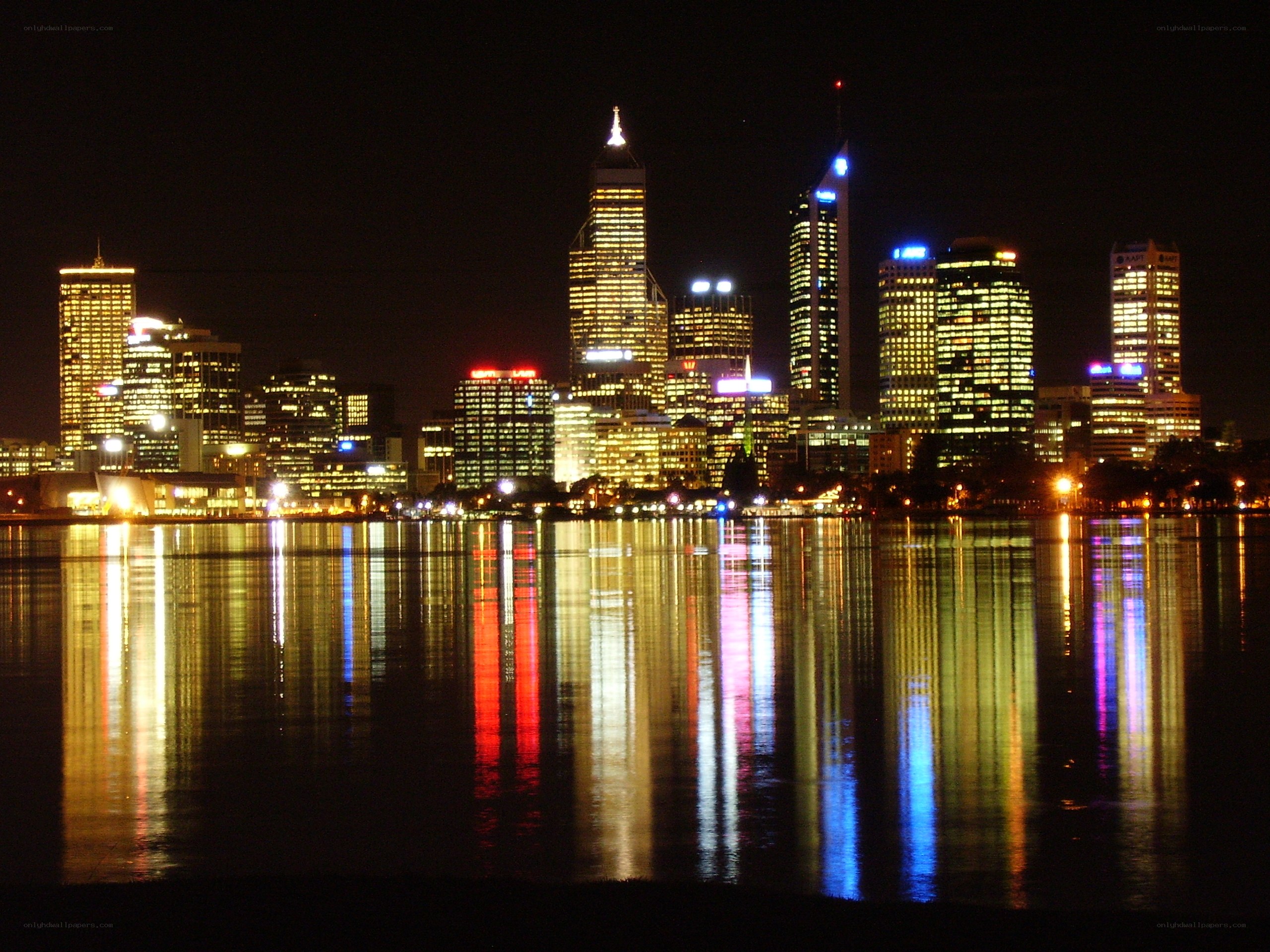 nighttime city skyline reflection