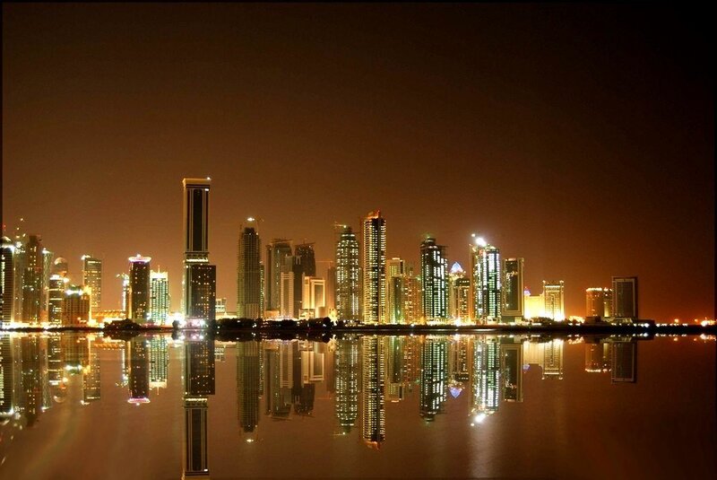 nighttime city skyline reflection