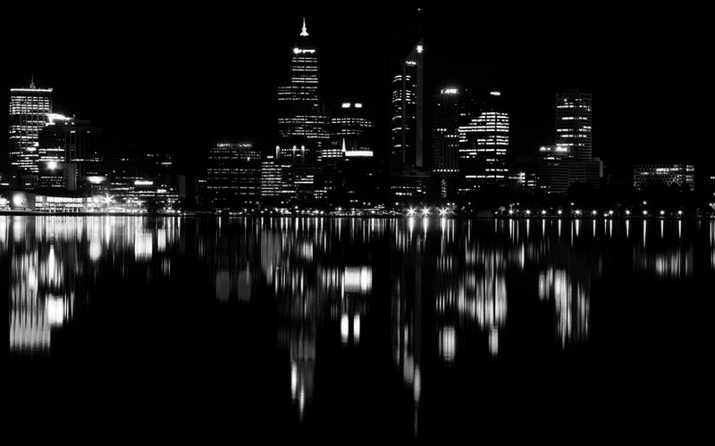 nighttime city skyline reflection