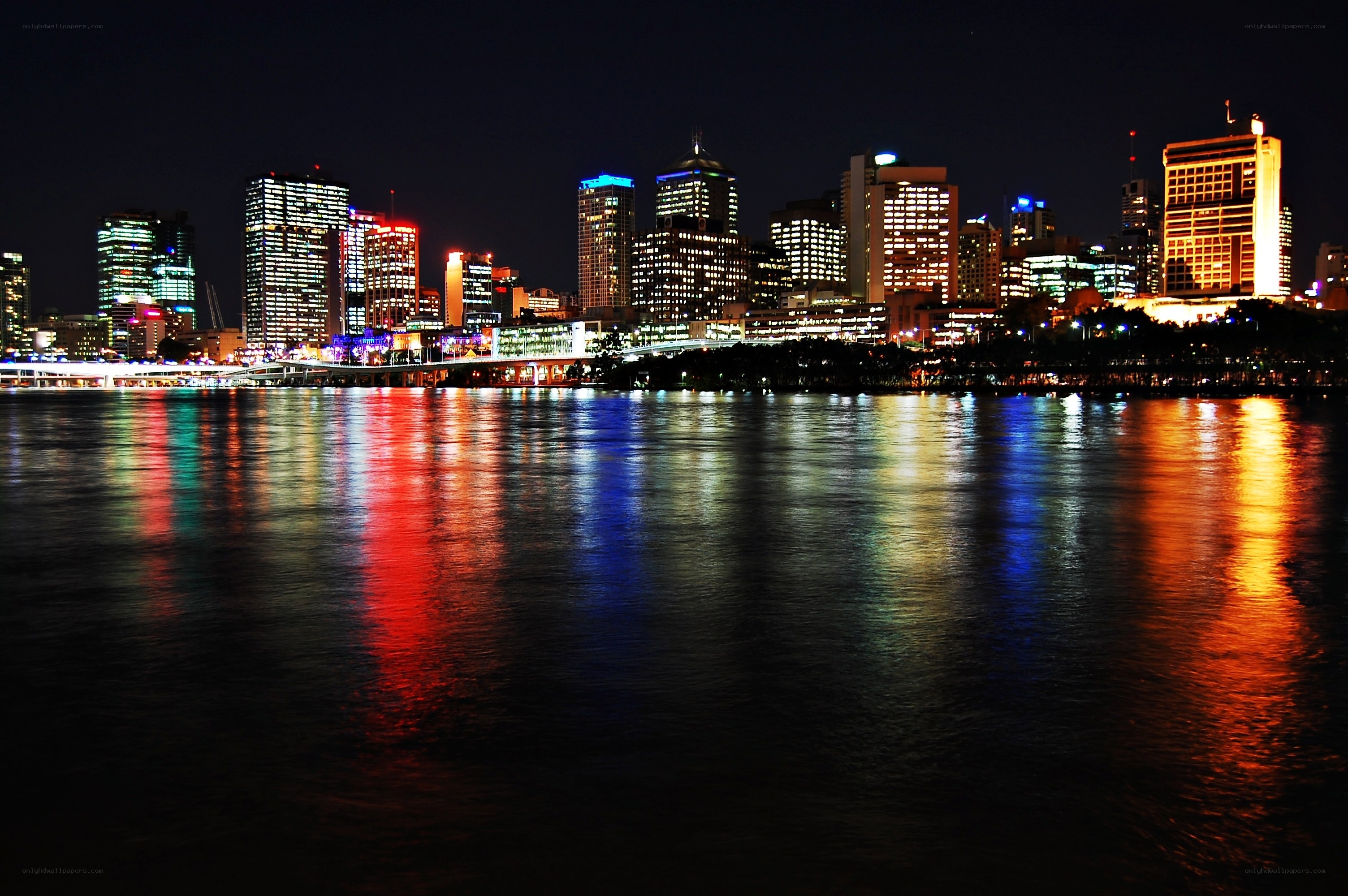 nighttime city skyline reflection