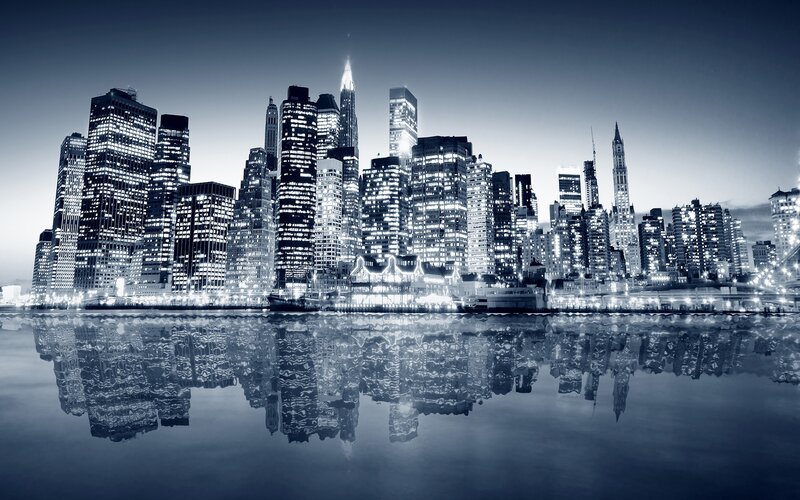 nighttime city skyline reflection