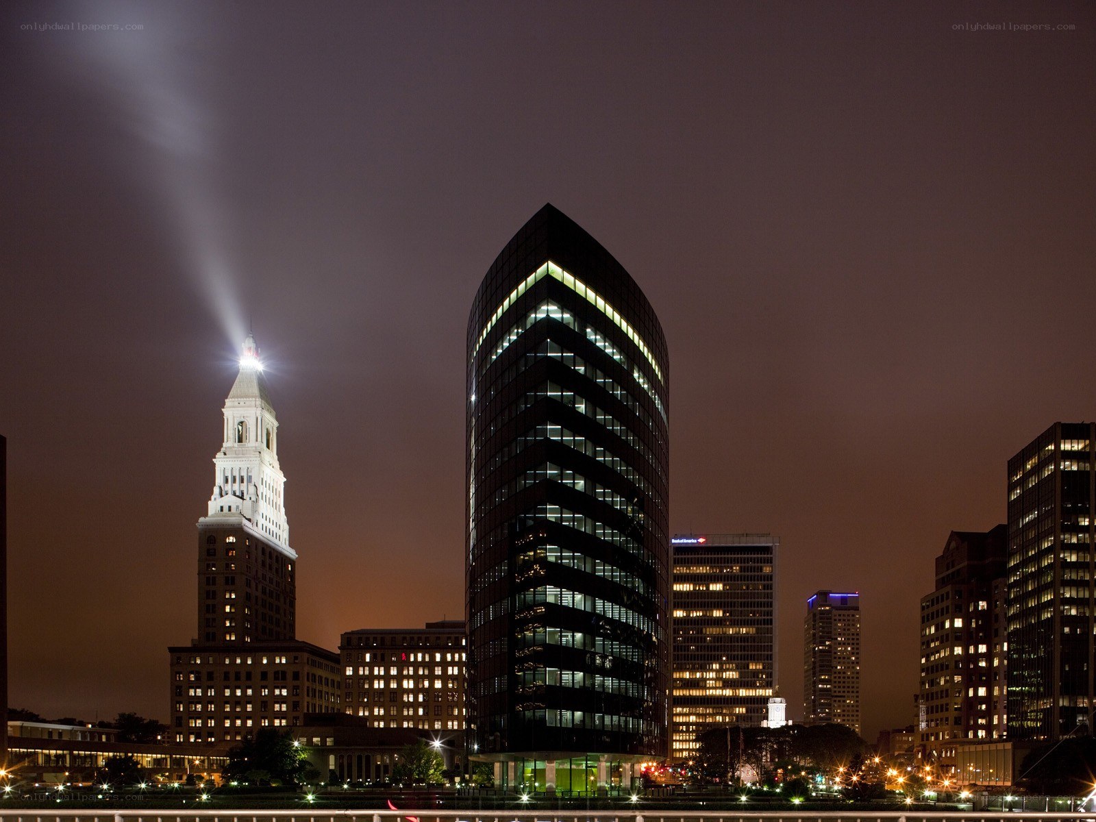 Nighttime city skyline with beacon