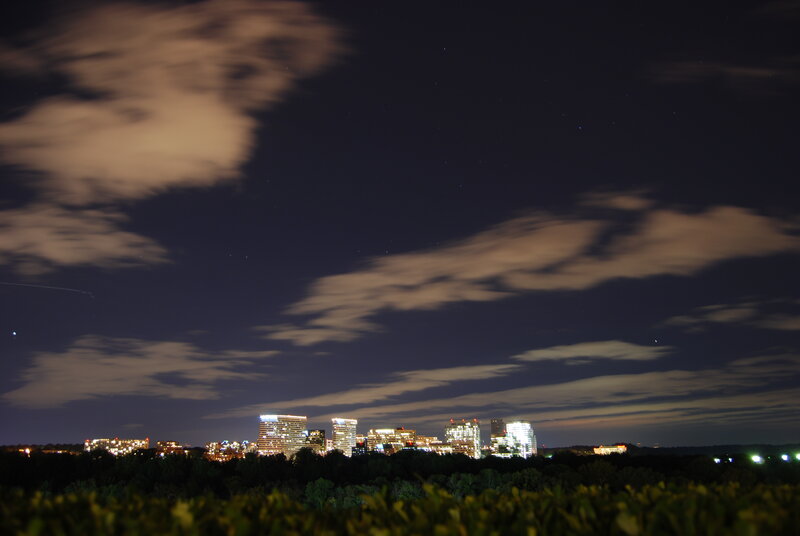 nighttime city skyline with clouds