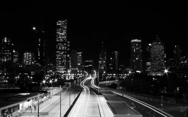 Nighttime city skyline with light trails