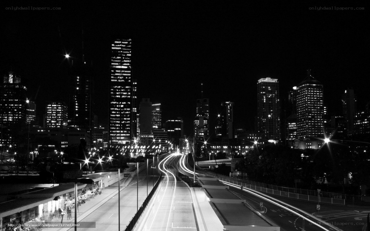 Nighttime city skyline with light trails