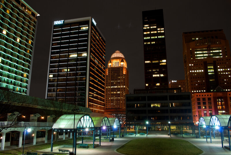 nighttime city skyline with lit buildings