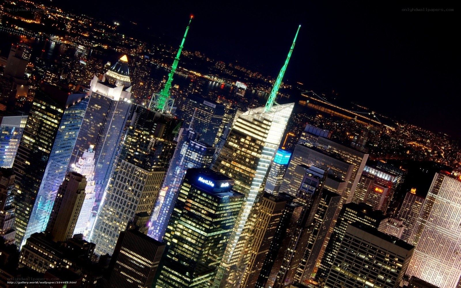 Nighttime city skyline with lit skyscrapers
