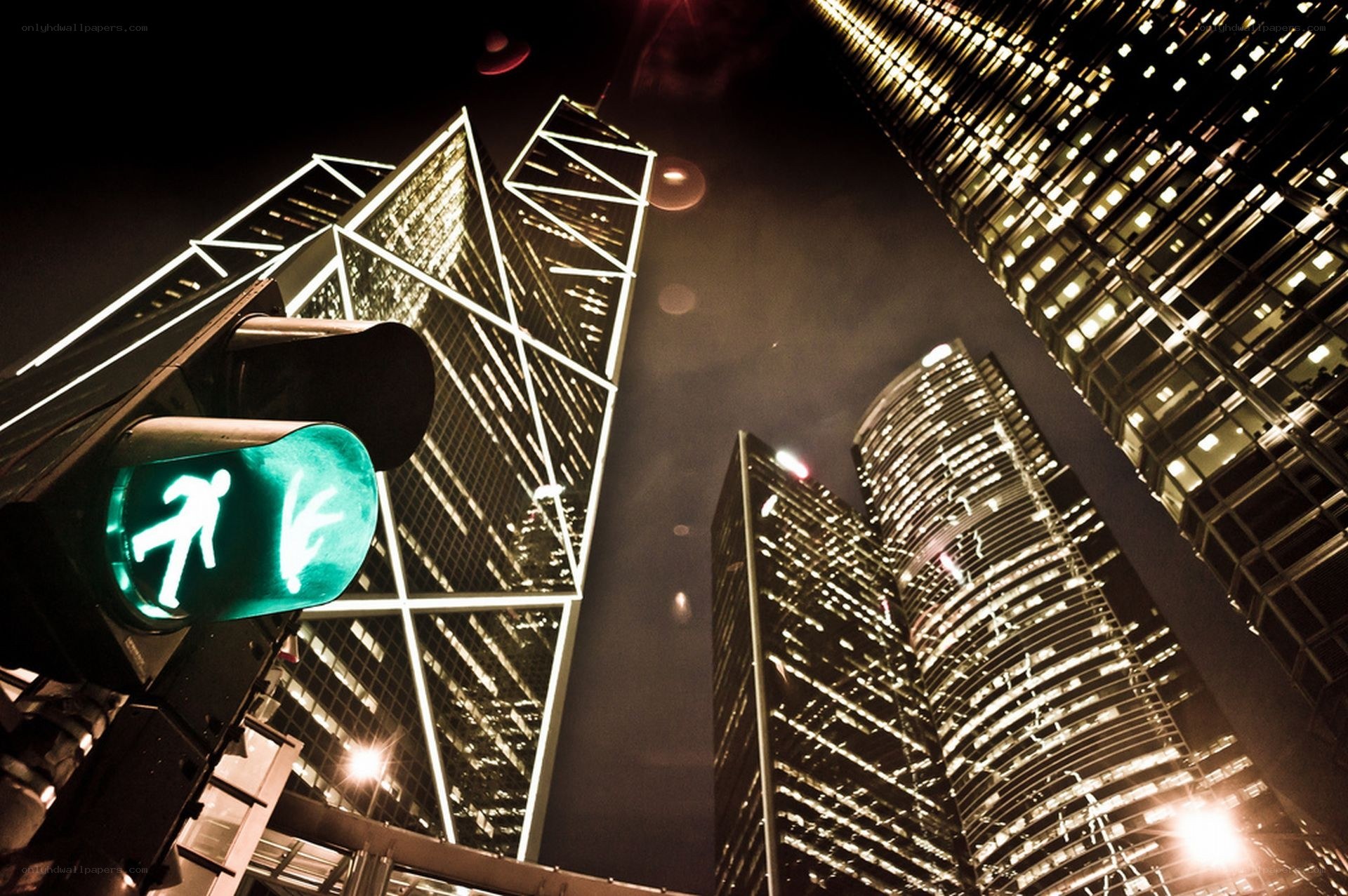 nighttime city skyline with pedestrian light