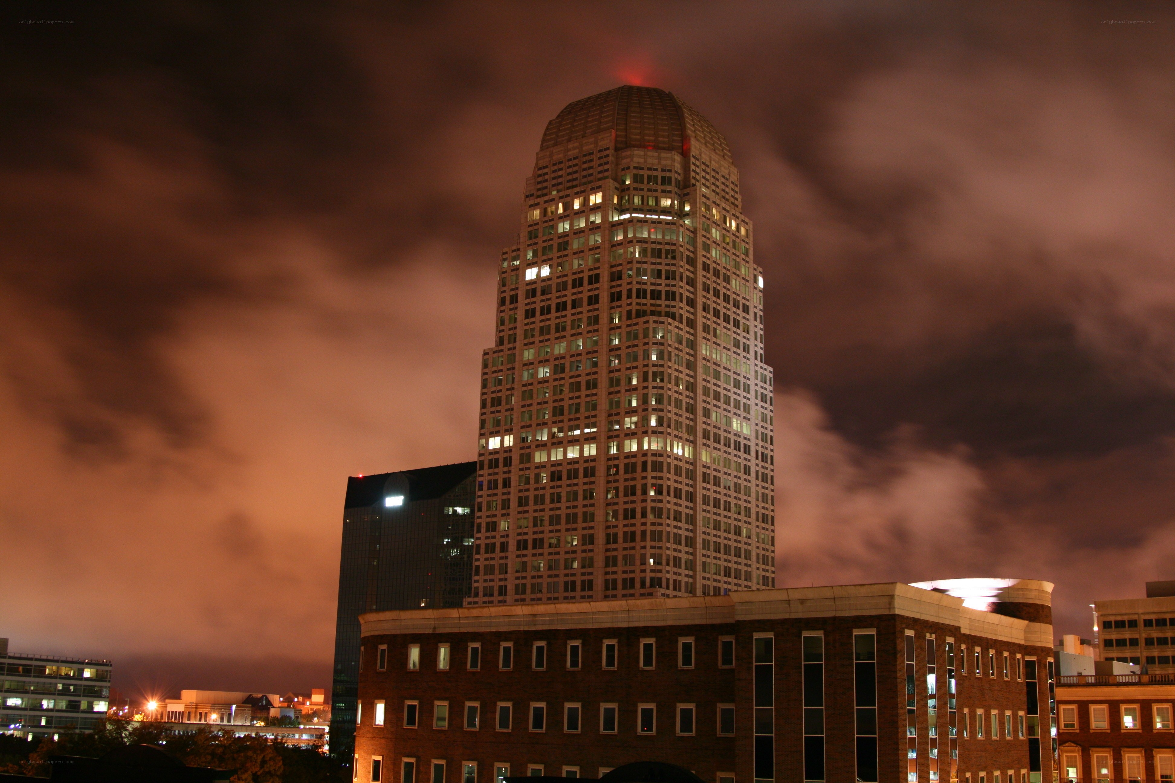 nighttime city skyline with skyscraper