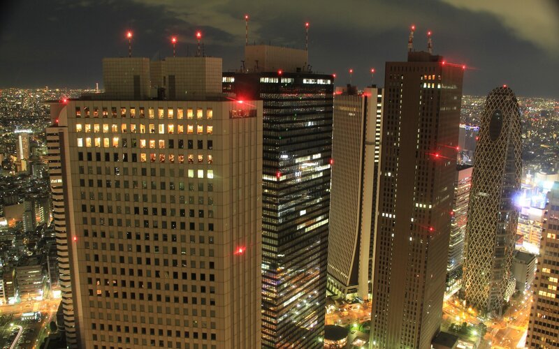 nighttime city skyline with skyscrapers