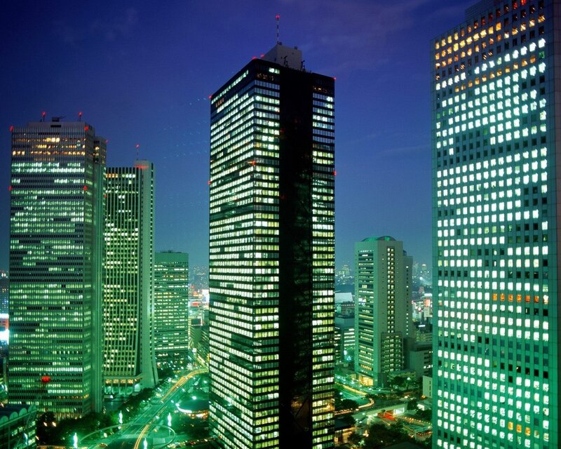 nighttime city skyline with skyscrapers