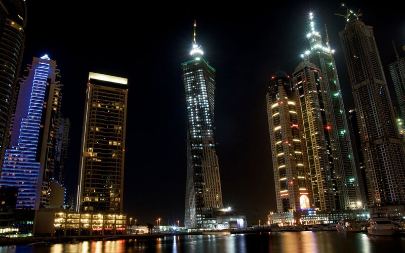 nighttime city skyline with skyscrapers