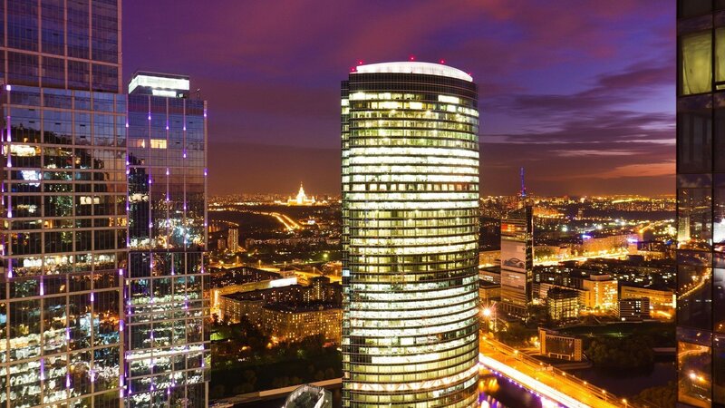 nighttime city skyline with skyscrapers