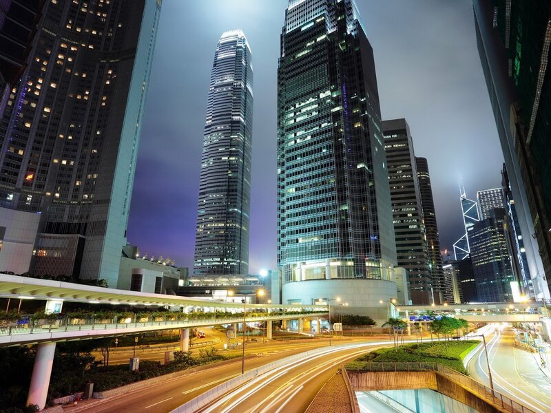Nighttime city skyline with skyscrapers