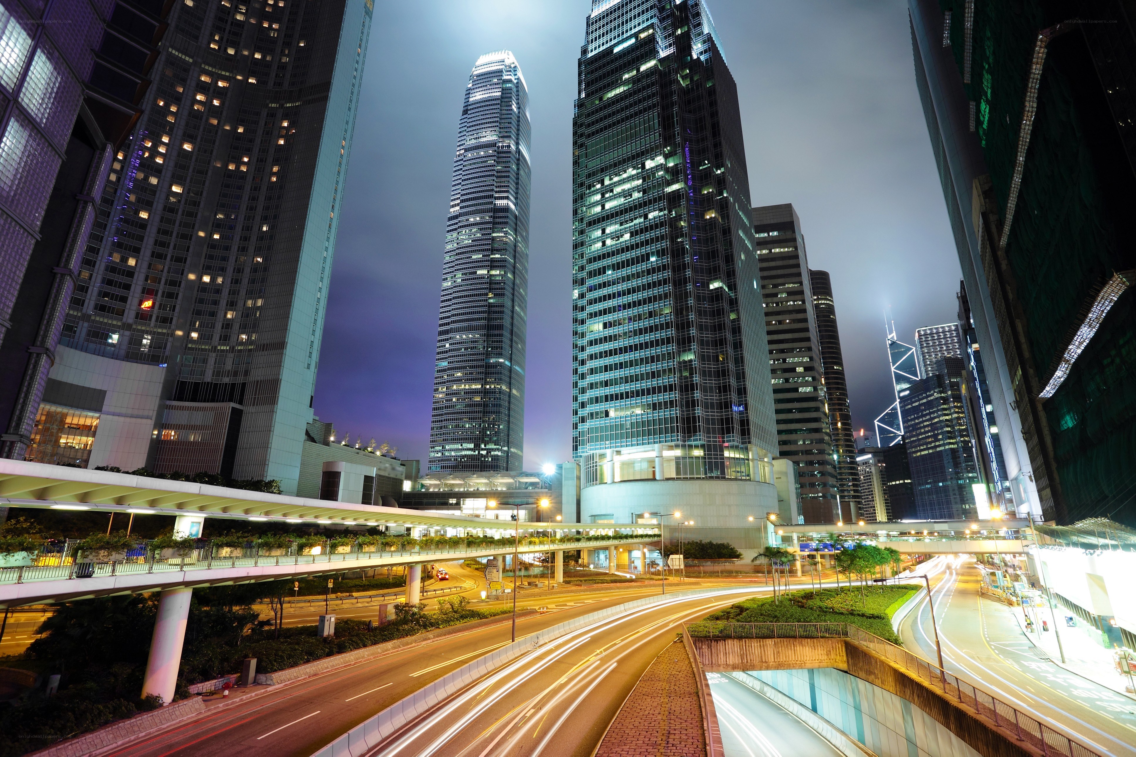 Nighttime city skyline with traffic