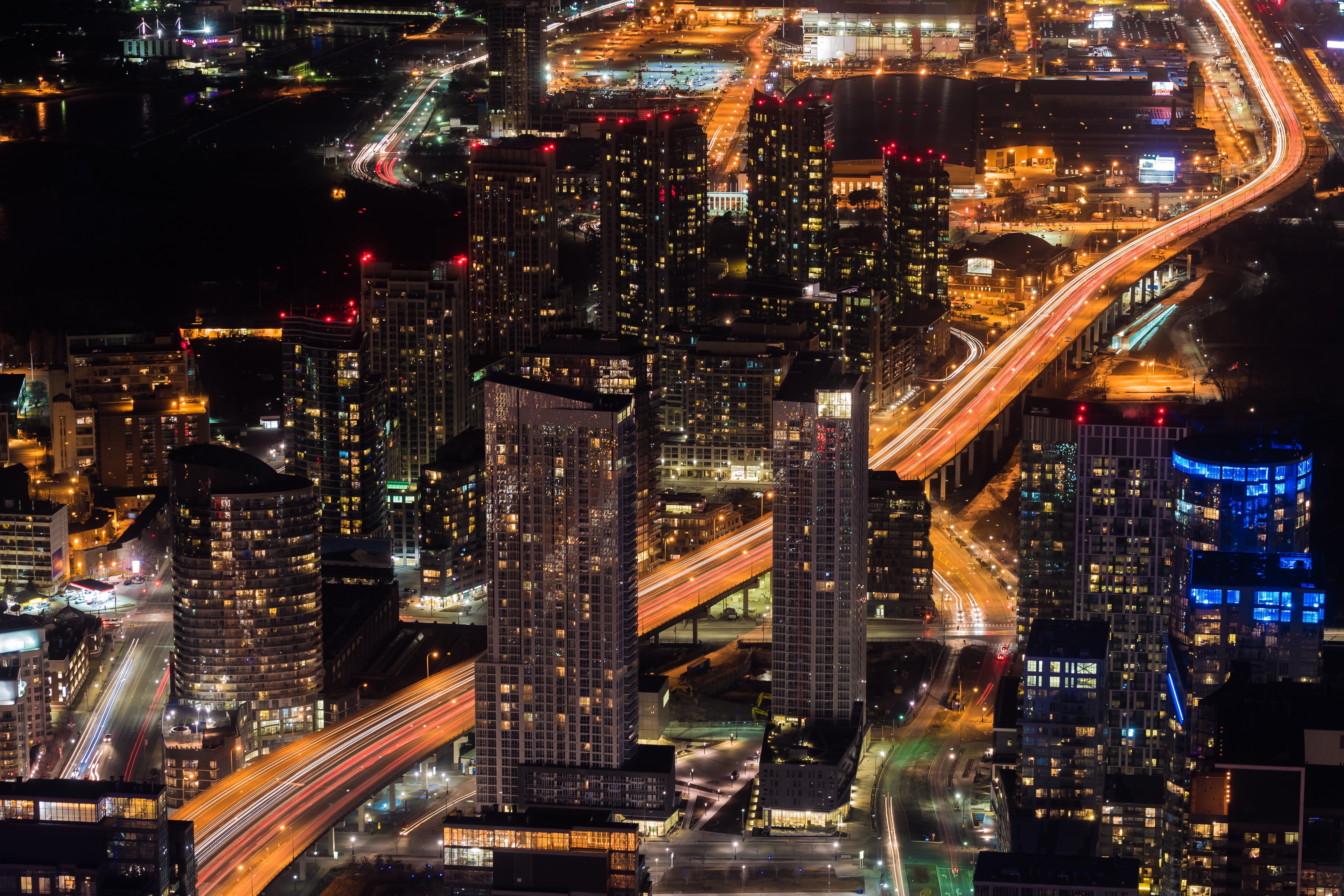 Nighttime city skyline with traffic