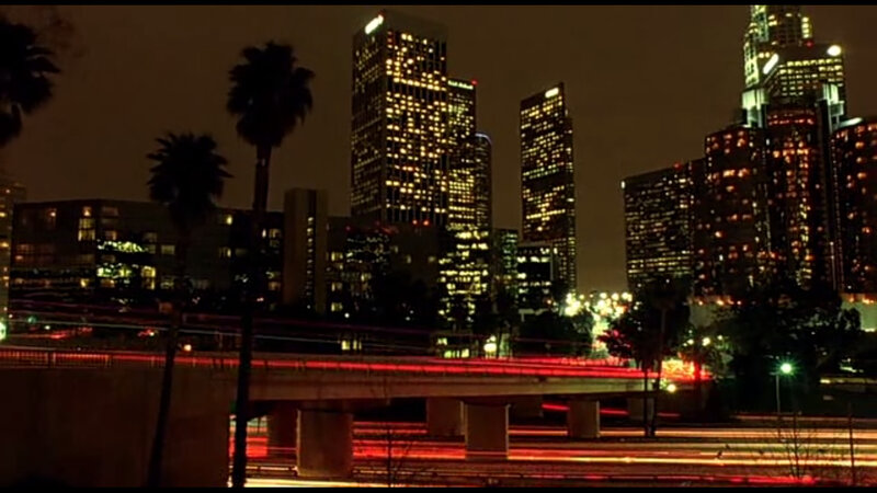 nighttime city skyline with traffic