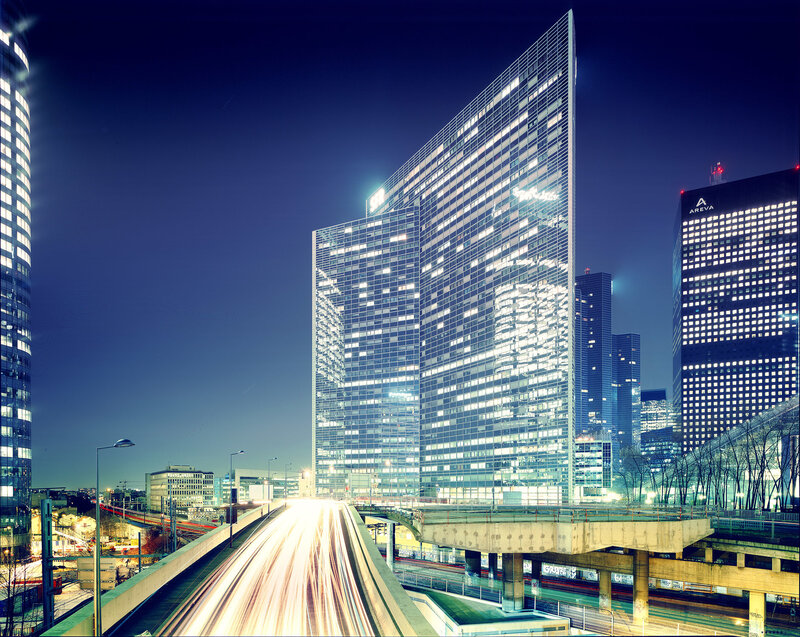 Nighttime city skyline with traffic