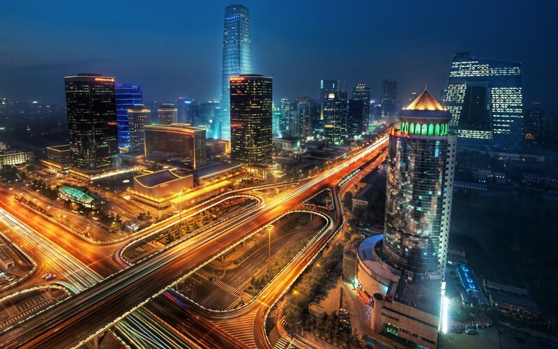 Nighttime city skyline with traffic