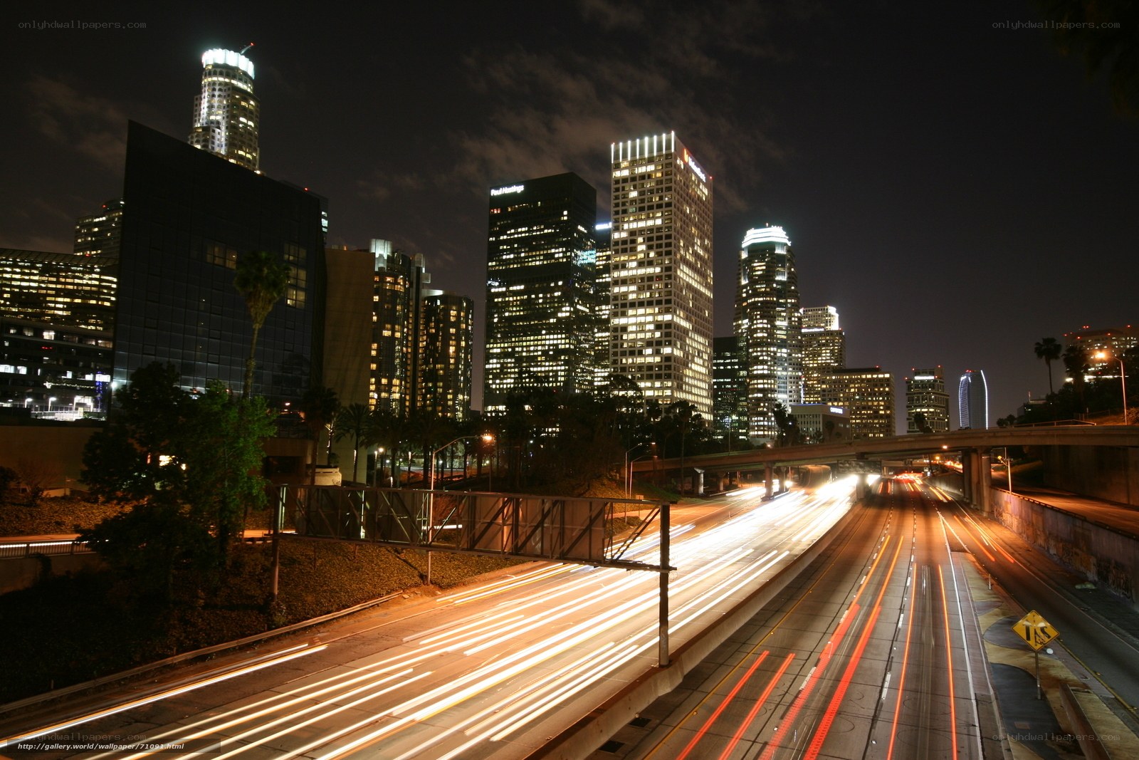 Nighttime city skyline with traffic