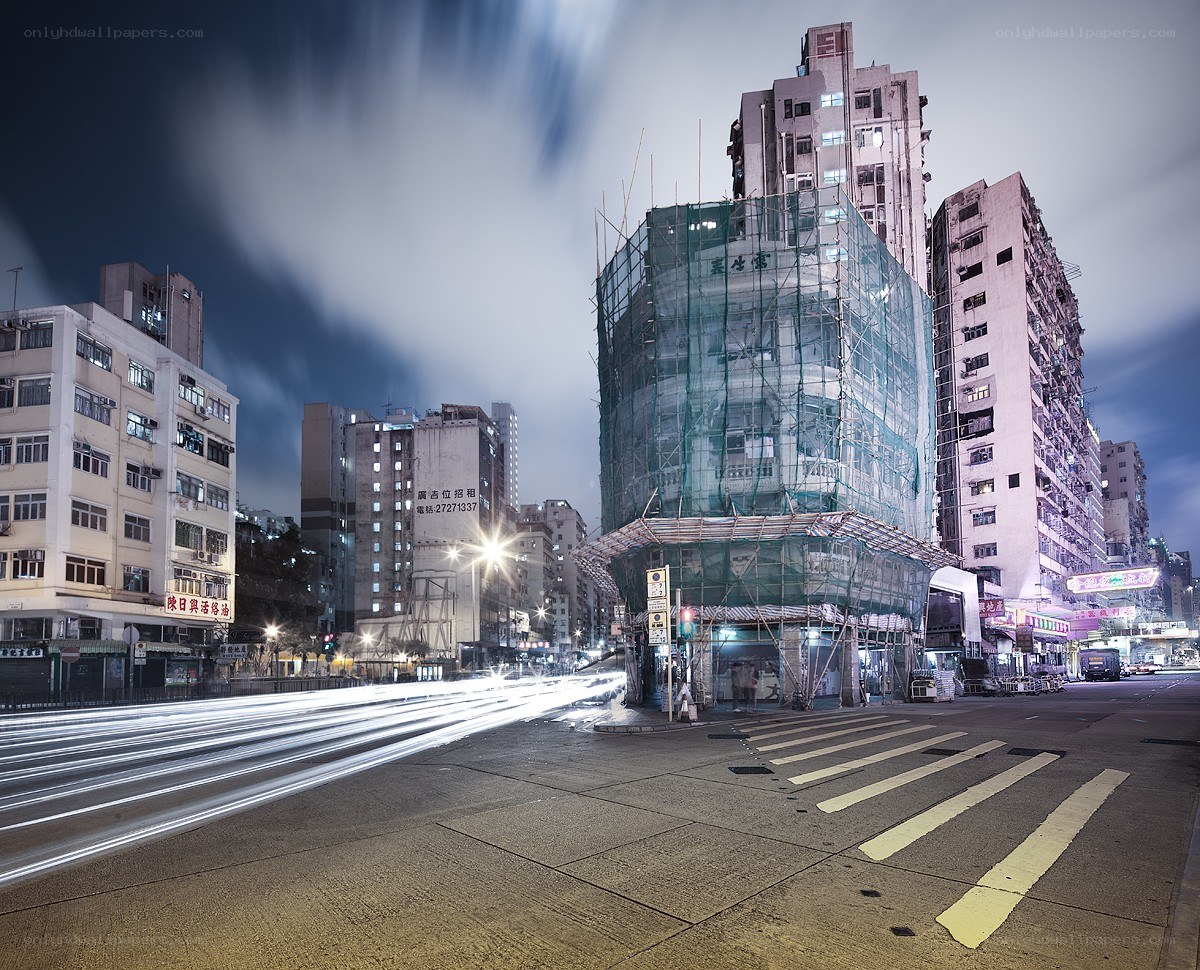 Nighttime city street with construction