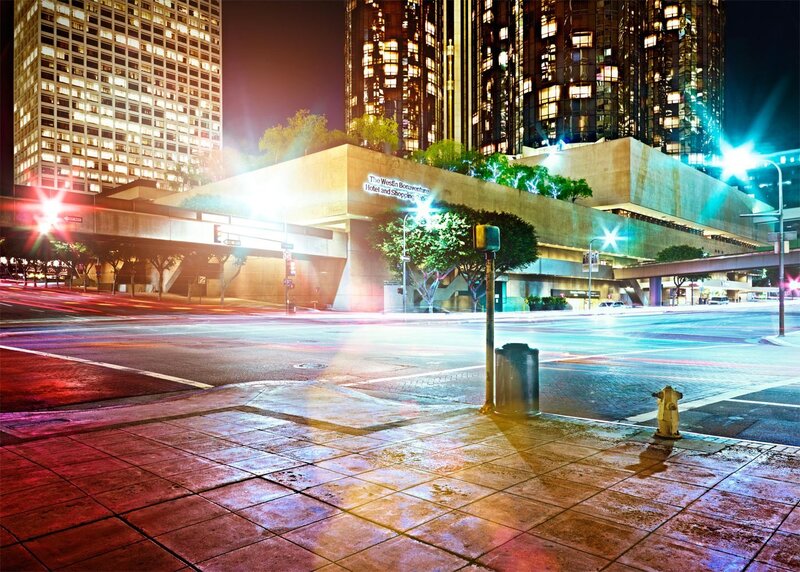 Nighttime city street with hotel
