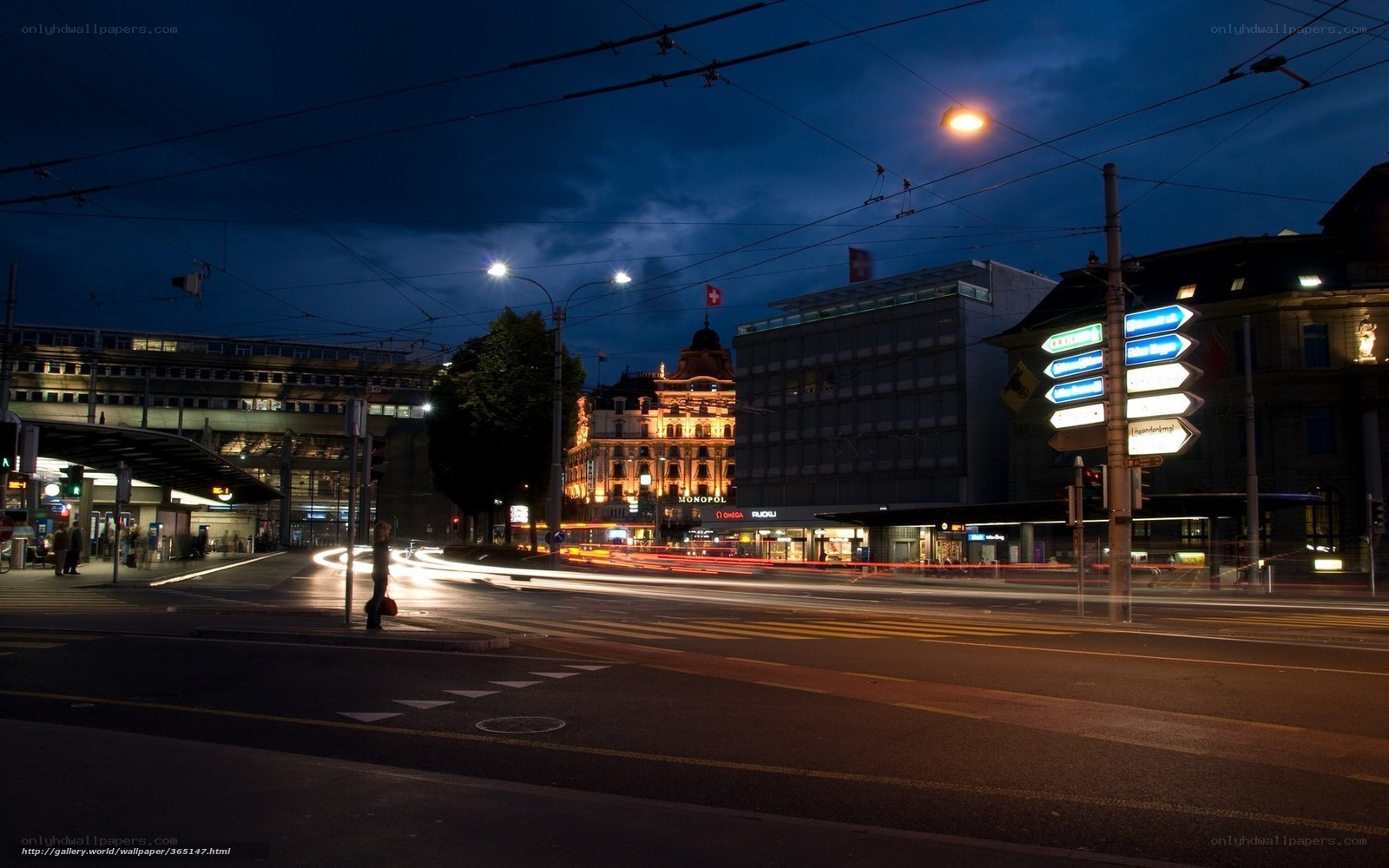 Nighttime city street with light trails