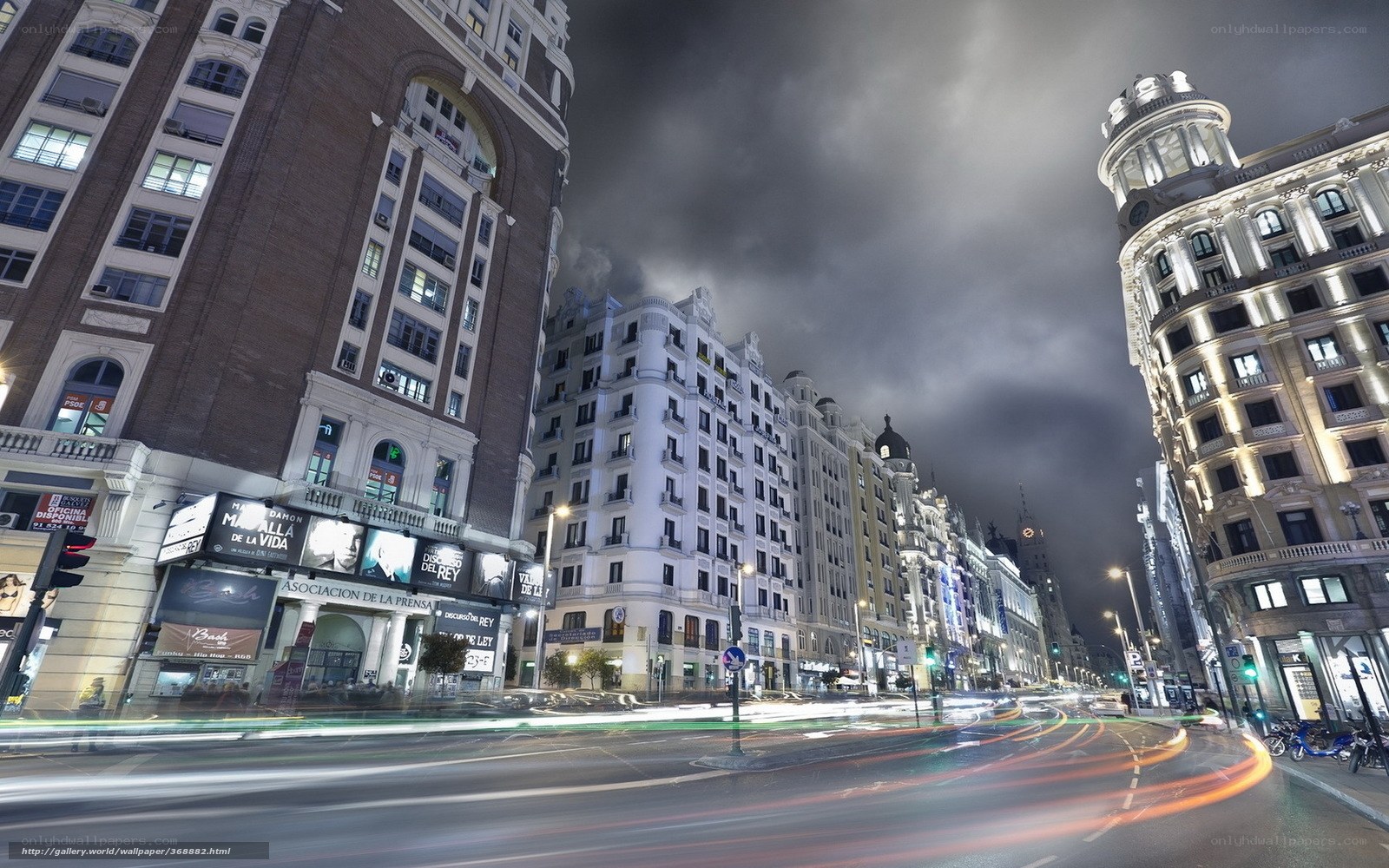 Nighttime city street with light trails