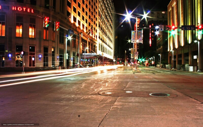 Nighttime city street with light trails