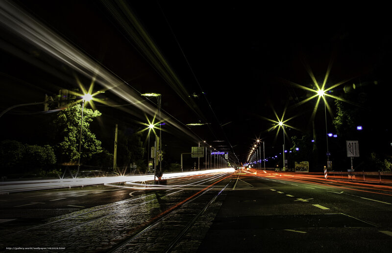 Nighttime city street with light trails