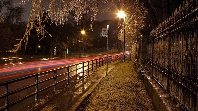Nighttime city street with light trails
