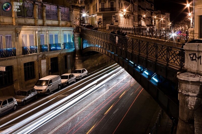 Nighttime city street with light trails